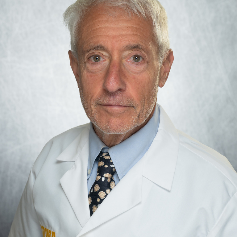 Stanley Perlman wearing lab coat